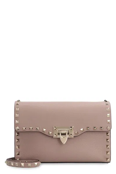 Shop Valentino Garavani - Rockstud Leather Crossbody Bag In Pink