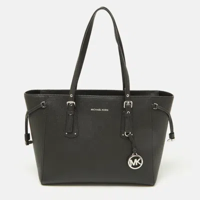 Shop Michael Kors Leather Voyager Tote In Black