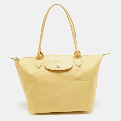 Shop Longchamp Nylon And Leather Le Pliage Tote In Yellow