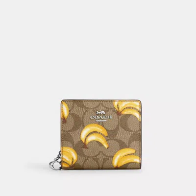 Shop Coach Outlet Snap Wallet In Signature Canvas With Banana Print In Multi