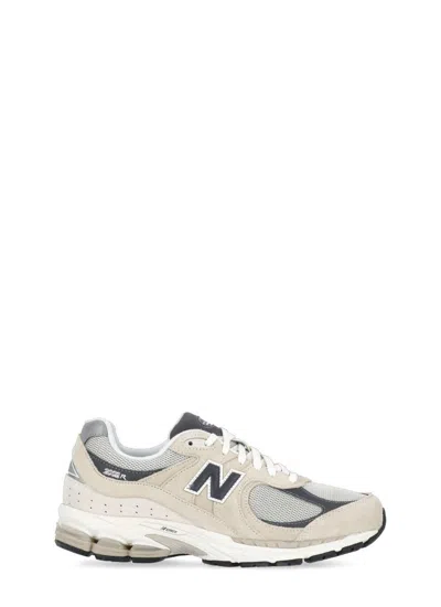 Shop New Balance Sneakers Beige