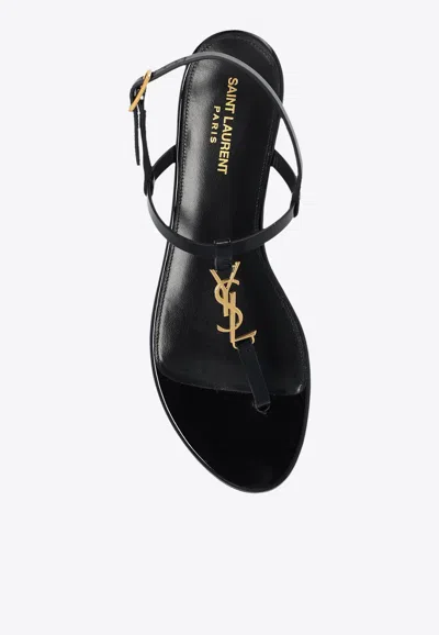 Shop Saint Laurent Cassandra Flat Thong Sandals In Black