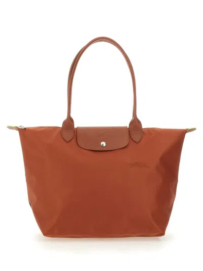 Shop Longchamp Le Pliage Large Bag In Brown