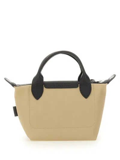 Shop Longchamp Le Pliage Xs Handle Bag In Beige