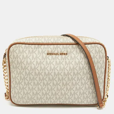 Shop Michael Kors Signature Coated Canvas And Leather East West Crossbody Bag In Beige
