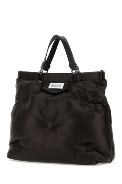 Shop Maison Margiela Handbags. In Black