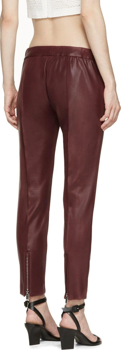 Shop Christopher Kane Burgundy Coated Slim Trousers
