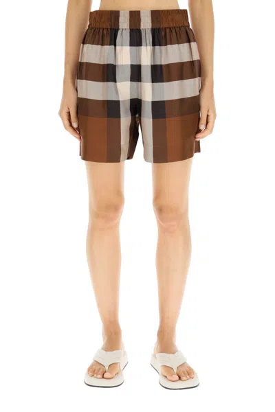 Shop Burberry Exploded Check Silk Shorts In Marrone