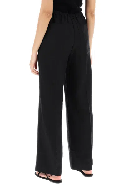 Shop Totême Lightweight Linen And Viscose Trousers In Nero