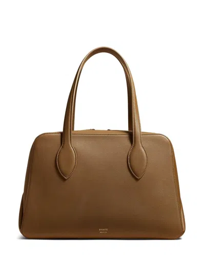 Shop Khaite Maeve Medium Handbag Bags In Brown