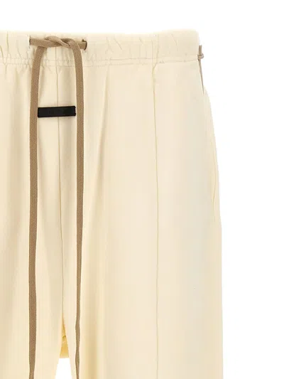 Fear Of God 'tailored Assembly' Trousers Featuring Elastic Waistband In Beige