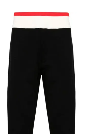 Shop Alexander Mcqueen Trousers In Black