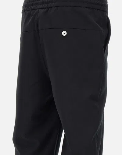 Shop Drôle De Monsieur Trousers In Black