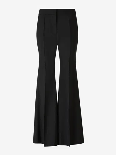 Shop Givenchy Crepe Flare Trousers In Black