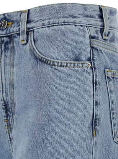 Totême Light Blue Wide Jeans With Logo Patch In Blue