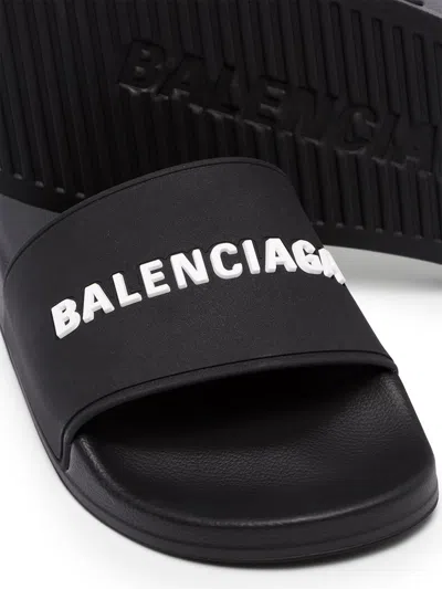 Shop Balenciaga Logo-embossed Slides In Black