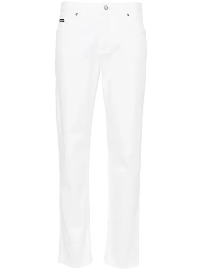 Shop Dolce & Gabbana Mid-rise Tapered Jeans
