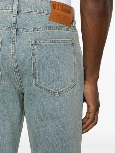 Shop Moschino Straight Jeans With A Faded Effect