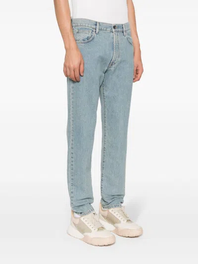 Shop Moschino Straight Jeans With Patch