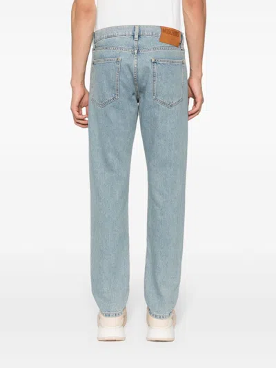 Shop Moschino Straight Jeans With Patch