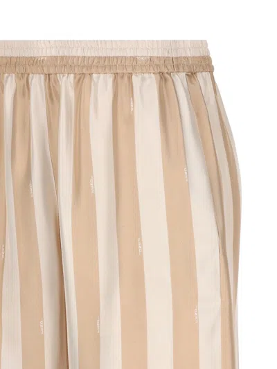 Shop Fendi Trousers In Linen/desert Sand