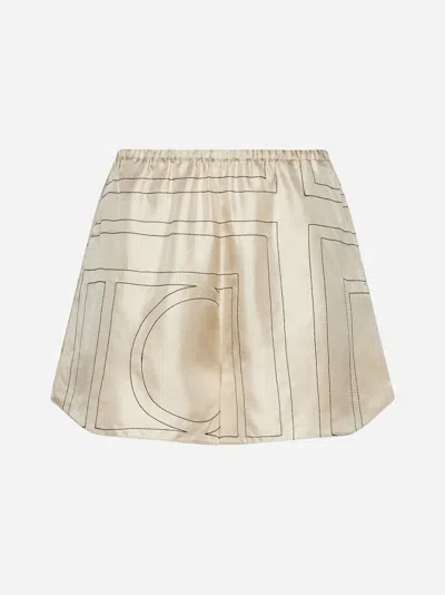 Shop Totême Monogram Silk Shorts In Ivory