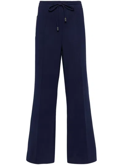 Shop Jw Anderson Bootcut Track Pants In Blue