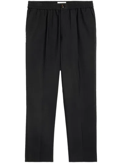 Shop Ami Alexandre Mattiussi Cropped Virgin Wool Tapered Trousers In Noir