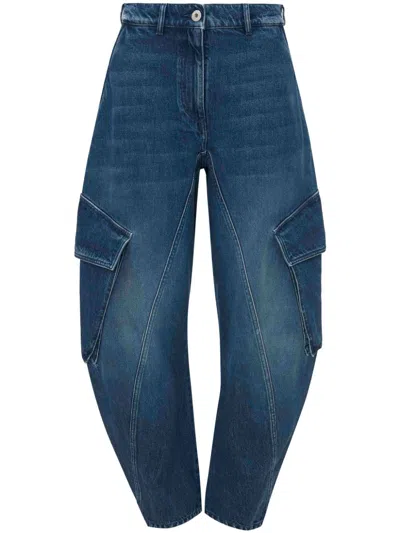 Shop Jw Anderson Curved-seam Tapered Jeans In Blue