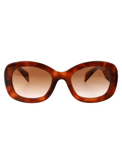 Shop Prada Sunglasses In 18r70e Cognac Tortoise
