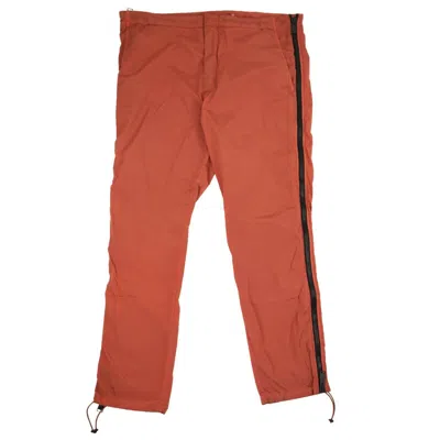 Shop Heron Preston Side Zipper Pants - Orange