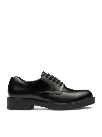 Shop Prada Brushed Leather Lace-up Shoes In Black