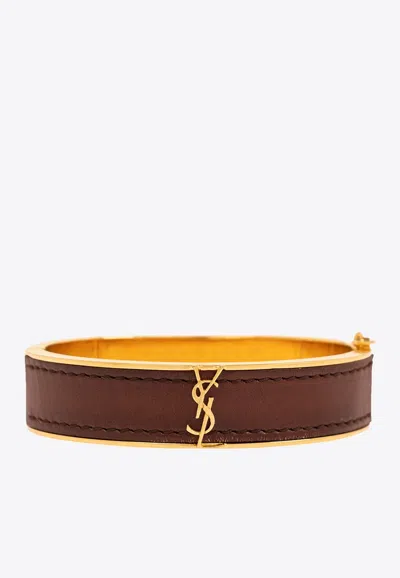 Shop Saint Laurent Cassandre Leather And Metal Bracelet In Gold