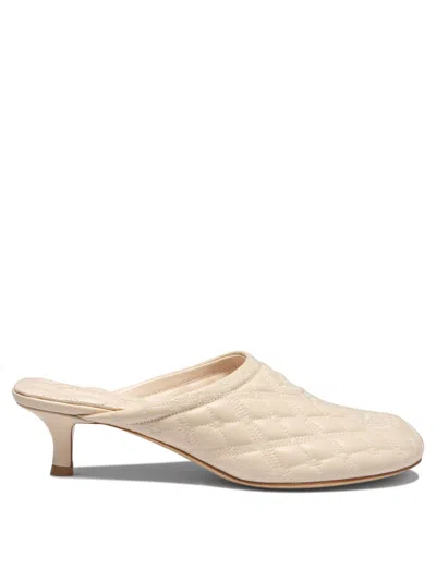 Shop Burberry "baby" Mules In Beige