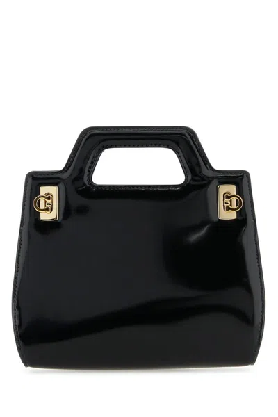 Shop Ferragamo Salvatore  Handbags. In Black Black