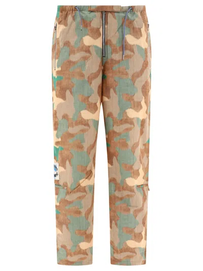 Shop Acne Studios Camo-print Trousers In Tan
