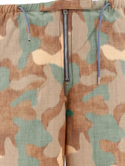 Shop Acne Studios Camo-print Trousers In Tan