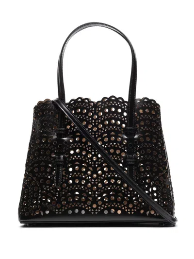 Shop Alaïa Black Cut-out Leather Handbag For Women In Noir