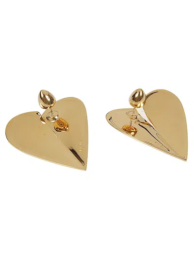 Shop Alaïa Gold Heart-shaped Earrings With Pin Closure