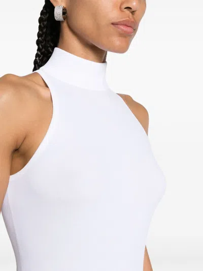 Shop Alaïa Sleeveless Turtleneck Bodysuit For Women In White In Black