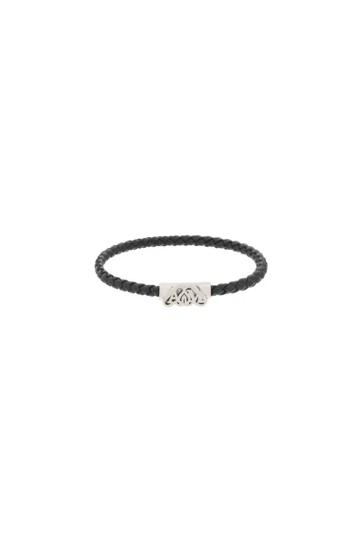Shop Alexander Mcqueen Braided Leather Bracelet With Magnetic Closure And Seal Logo Detail In Black