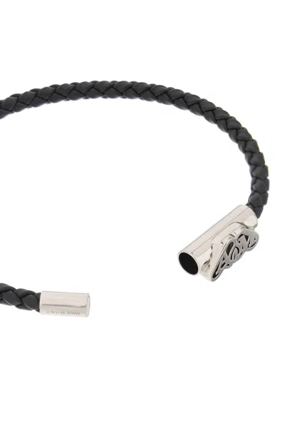 Shop Alexander Mcqueen Braided Leather Bracelet With Magnetic Closure And Seal Logo Detail In Black