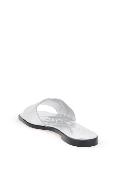 Shop Alexander Mcqueen Glamorous Laminated Slides With Imprinted Logo For Women In Gray For Ss24 In Grey