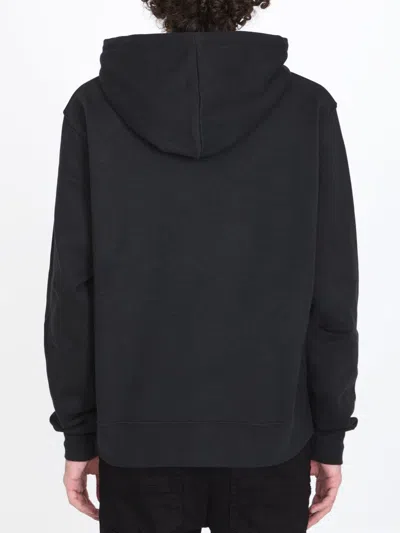 Shop Amiri Staggered Logo Hoodie In Black Cotton For Men