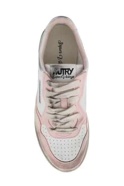 Shop Autry Vintage Pink Sneakers For Women In Tan