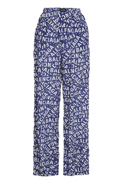 Shop Balenciaga All Over Logo Printed Silk Pajama Pants For Women In Blue