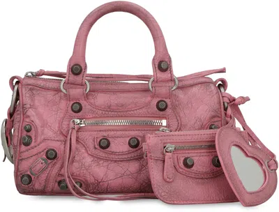 Shop Balenciaga Mini Duffle Vintage Pink Lamb Leather Crossbody Bag With Decorative Studs And Removable Pouch