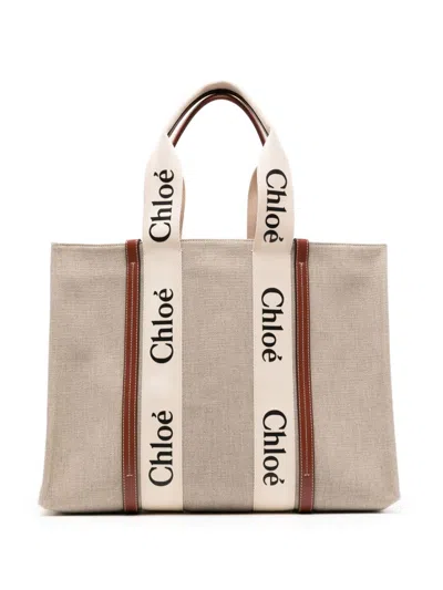 Shop Chloé Woody Canvas And Leather Tote Handbag Handbag In Brown