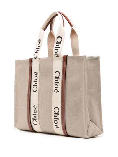 Shop Chloé Woody Canvas And Leather Tote Handbag Handbag In Brown