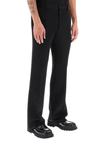 Shop Dolce & Gabbana Flared Wool Trousers For Men In Black